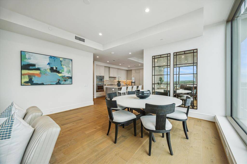 Spacious dining area features an open-concept layout seamlessly connected to the kitchen and living spaces.