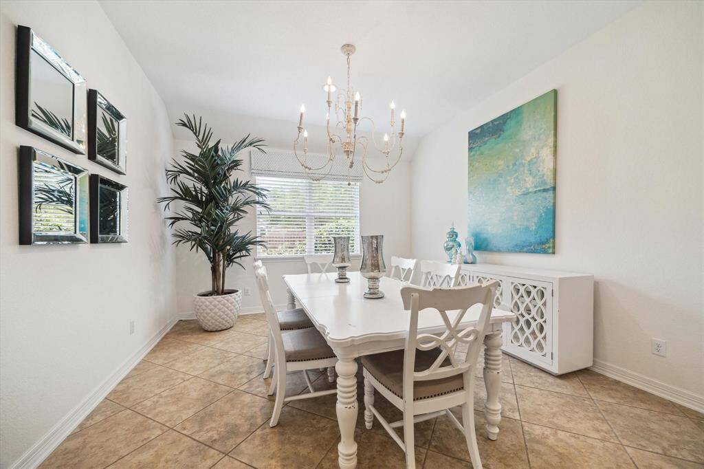 Just off the kitchen, this spacious room is currently used as a breakfast room, but its versatile layout makes it ideal for a home office, craft room, or even a formal dining space. Its close proximity to the main living area keeps you connected to the heart of the home while still offering a dedicated space for focus or creativity.