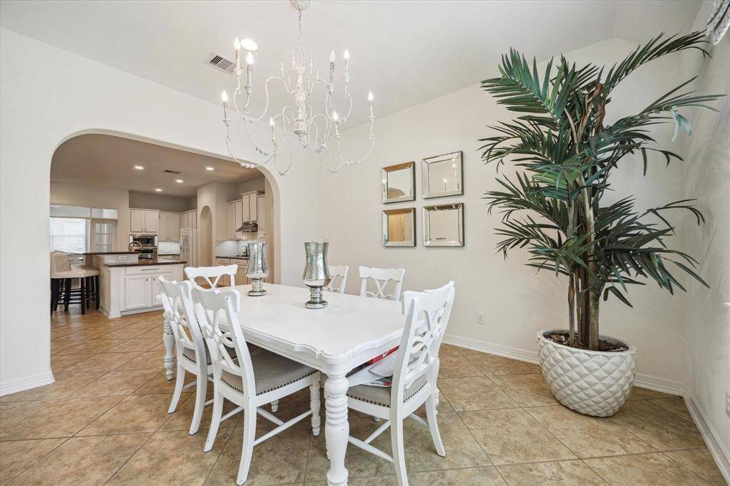 This generously sized room off the kitchen offers endless possibilities—perfect as a breakfast nook, home office, craft room, or formal dining area. Its location keeps it connected to the central living space while providing flexibility to fit your lifestyle needs.