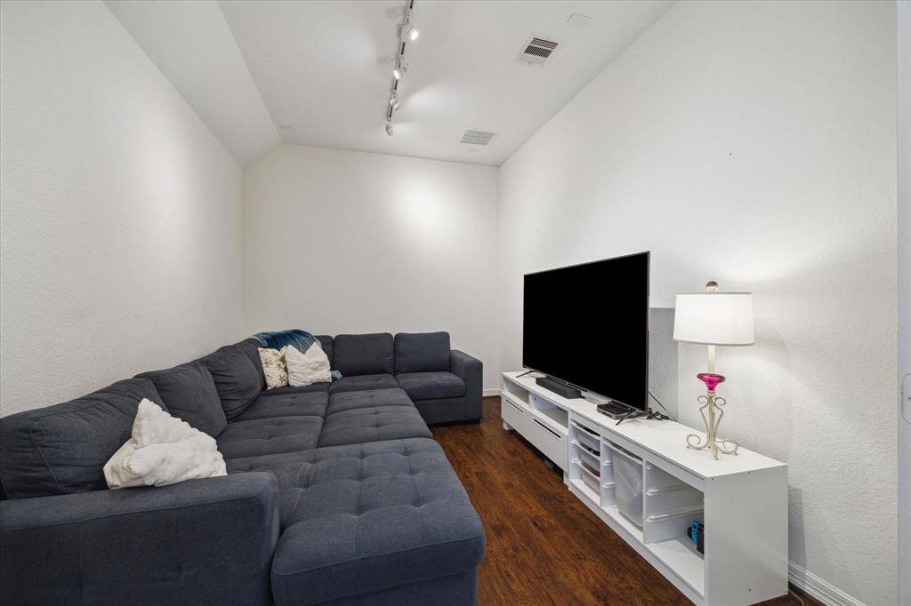 Connected to the game room, the first-floor media room is the ultimate cozy retreat for movie nights or weekend binge-watching. Plenty of room for a cozy sectional so you can enjoy a favorite film in a space designed for comfort and connection.