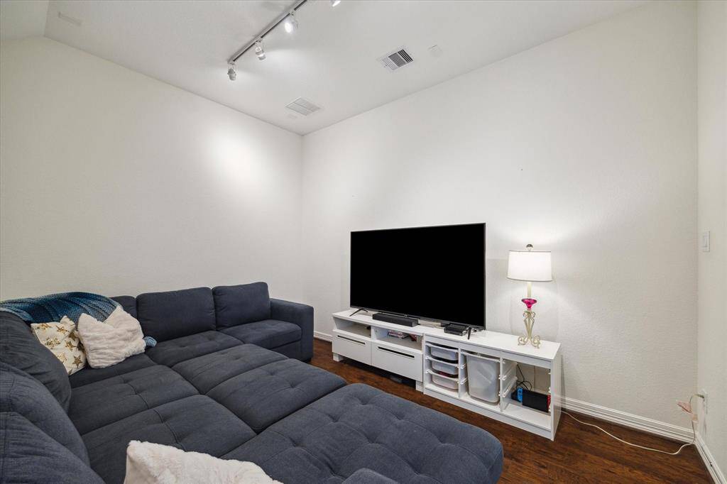 Connected to the game room, the first-floor media room is the ultimate cozy retreat for movie nights or weekend binge-watching. Plenty of room for a cozy sectional so you can enjoy a favorite film in a space designed for comfort and connection.
