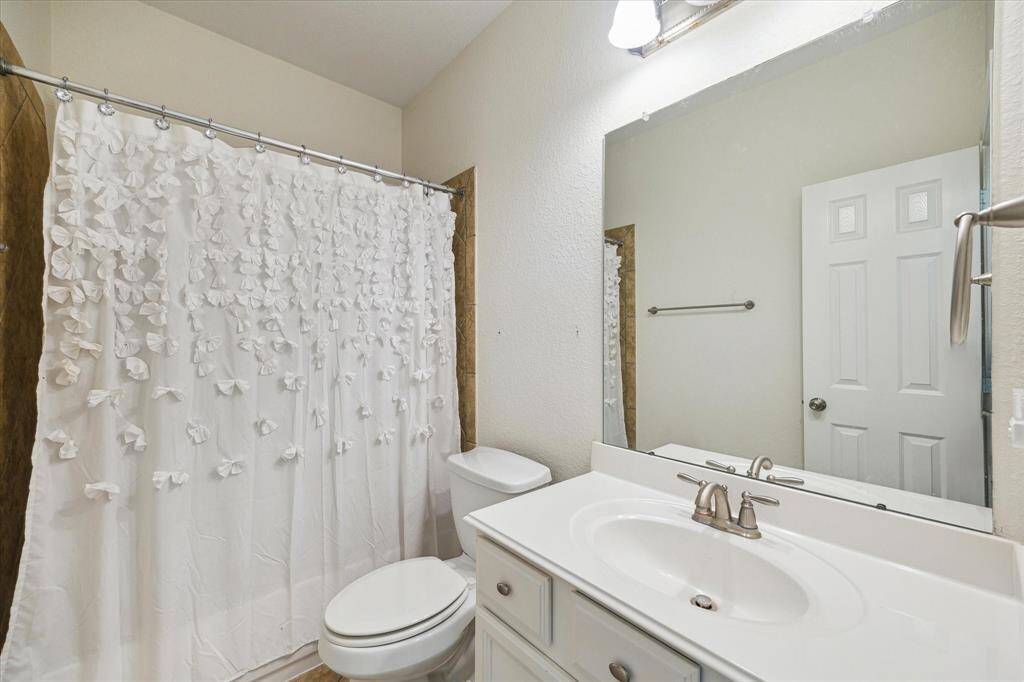 This guest bathroom serves the guest room at the back right corner of the home.