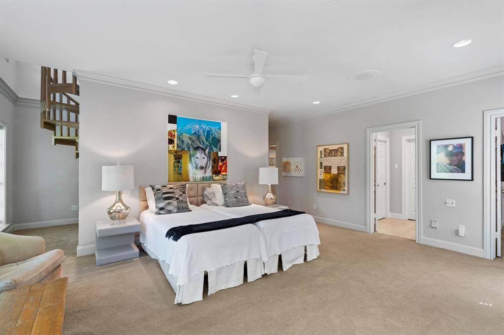 The Primary Bedroom suite includes a fireplace, crown molding, and windows facing north with peaceful views of the ravine. Note the Study or yoga/meditation area behind the wall.
