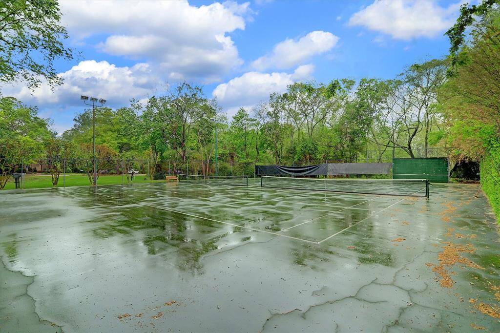 Behind the gated area of Indian Circle, the  community offers tennis courts with additional seating areas and tree-lined backdrop.