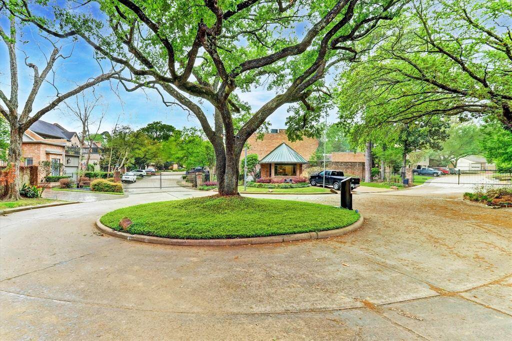 View of the guard station located just across the street from 5722 on a quiet cul-de-sac with ample parking and a peaceful, tree-lined street.