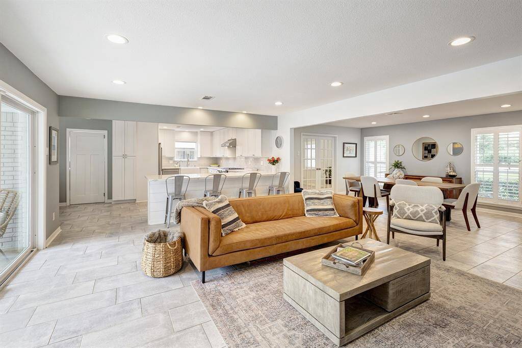 Living room with kitchen counter seating in the back