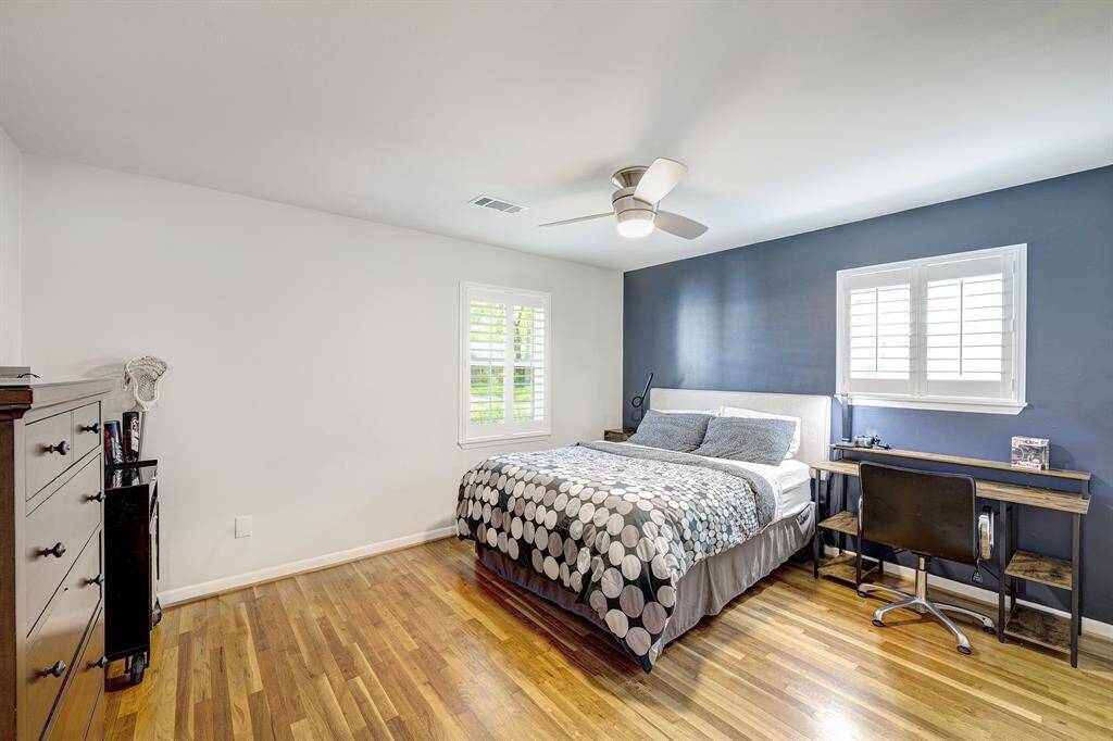 Front secondary bedroom with refinished hardwood floors