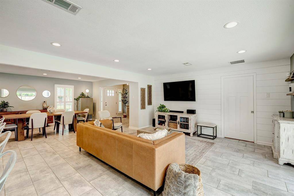 Living room with recessed lighting and a view to the formal dining
