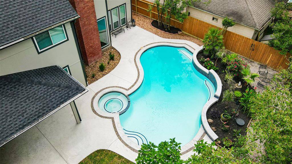 Welcome to your own private paradise located on 5807 Mountain View Dr! The property is surrounded by lush landscaping, offering privacy and a serene environment, ideal for relaxation and entertainment.
