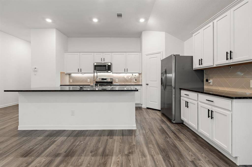 Plenty of storage in the kitchen.  Side cabinets are great for a butler's pantry or coffee bar!
