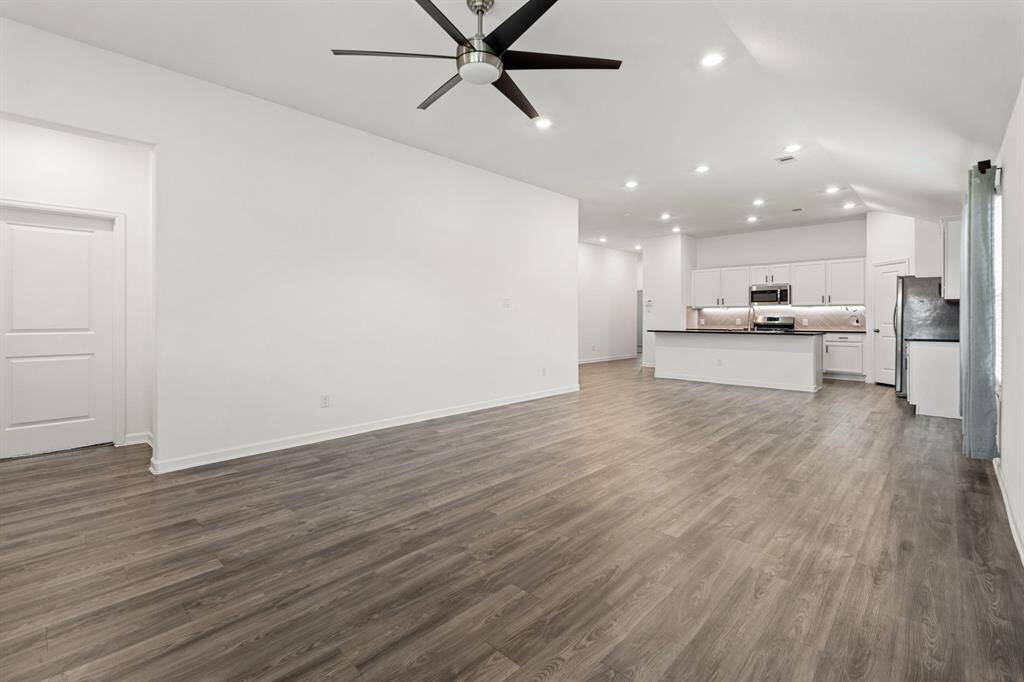 Large living room, open to dining.
