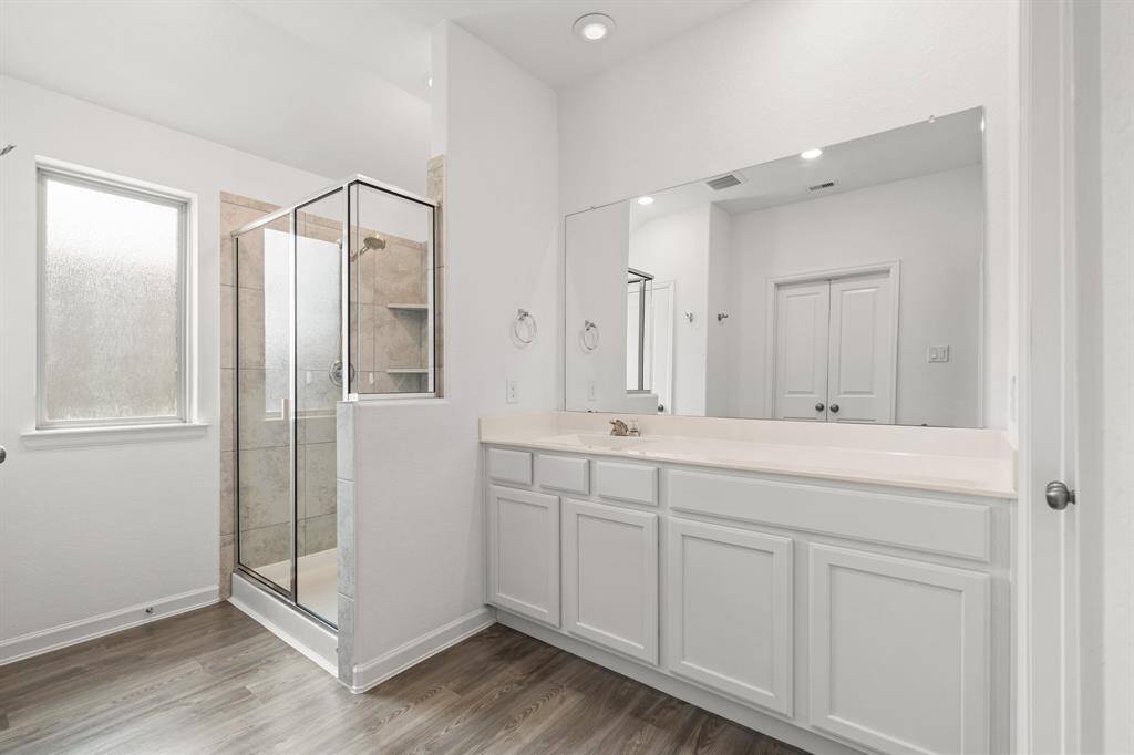 Bright and fresh primary bathroom.