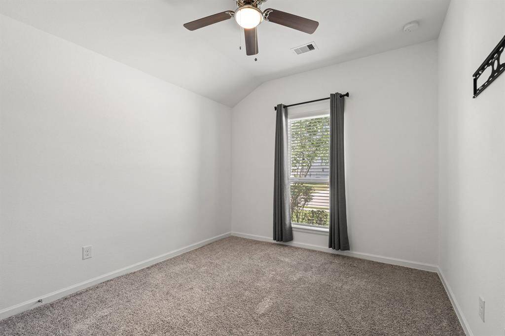 Spacious bedroom at front of  home.