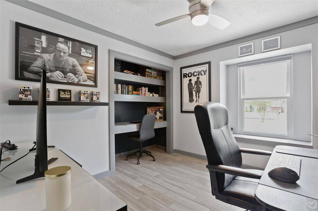 Fresh paint and wood like tile floors continue into the secondary bedrooms.