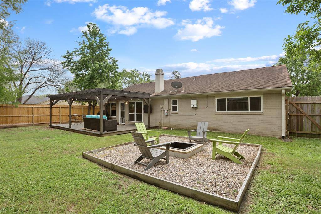 Relax in the backyard on the spacious deck or around the custom fire pit.