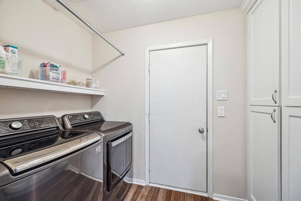 This large laundry room has plenty of space to keep everything organized, making laundry day a breeze.