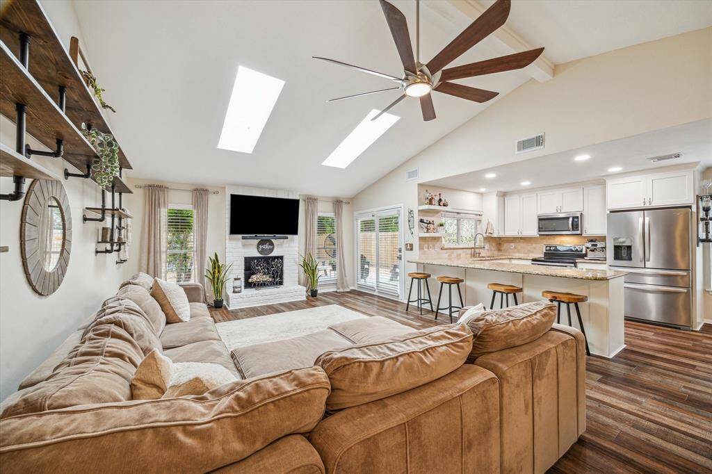 The heart of the home! This thoughtfully designed layout connects the family room, dining area and kitchen. Vaulted ceilings and strategically placed skylights make the space feel airy and effortlessly inviting.