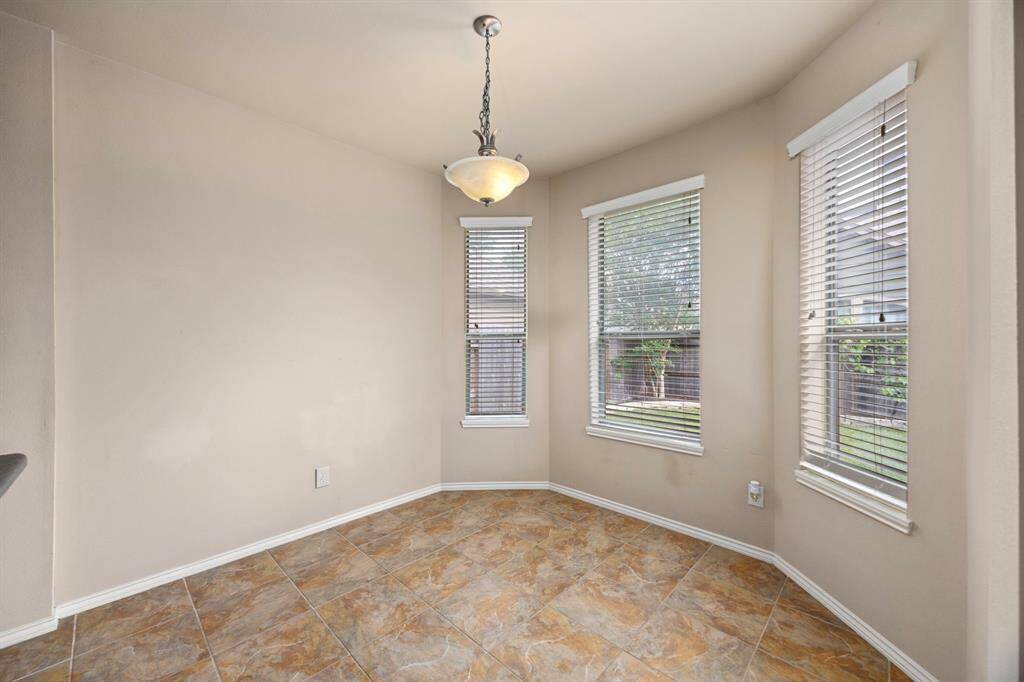 The breakfast area features large windows for even more natural light.