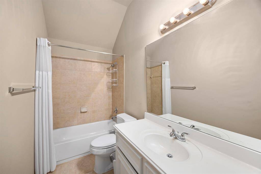 The upstairs full bath features a sink with ample counter space.