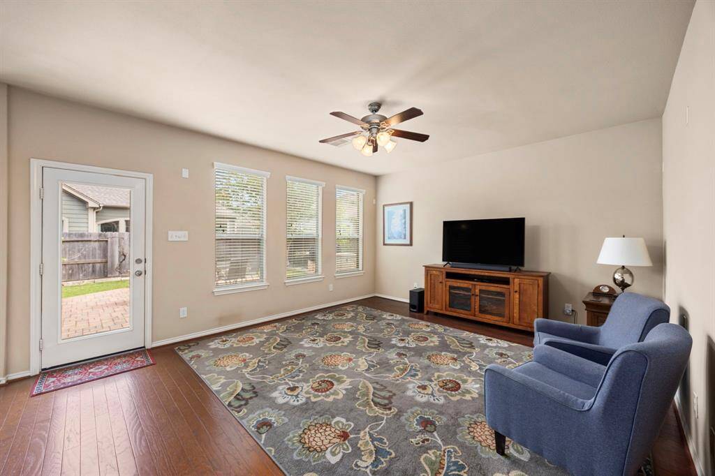 High ceilings and large windows are wonderful features allowing plenty of natural light into the room!