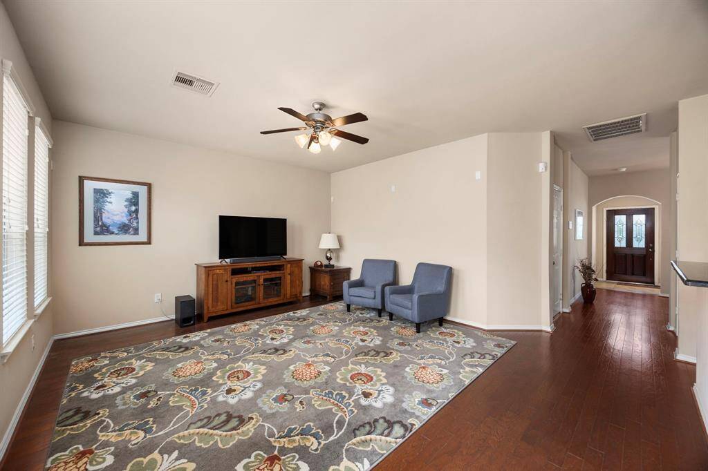 The home features a large living space adjacent to the kitchen perfect for entertaining.