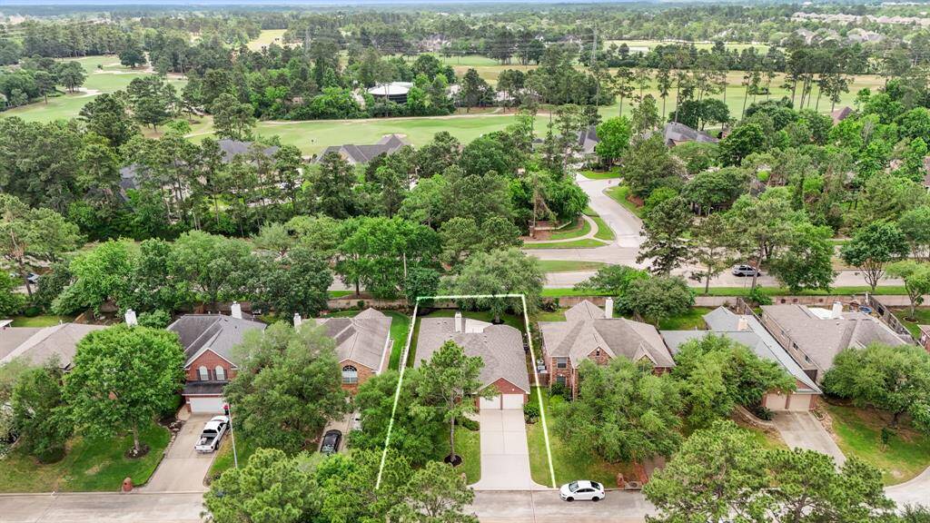 This aerial view showcases the home's prime location—no rear neighbors and just moments from the golf course in the heart of Windrose.