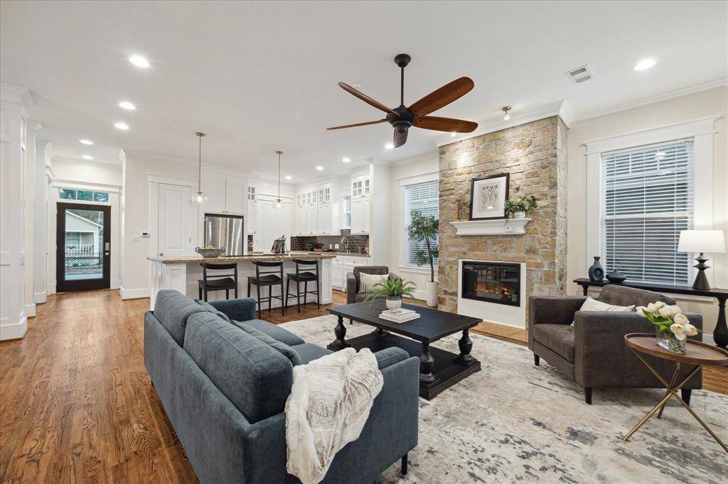 Enjoy entertaining in this open concept living, kitchen and dining area with an island kitchen and high ceilings.