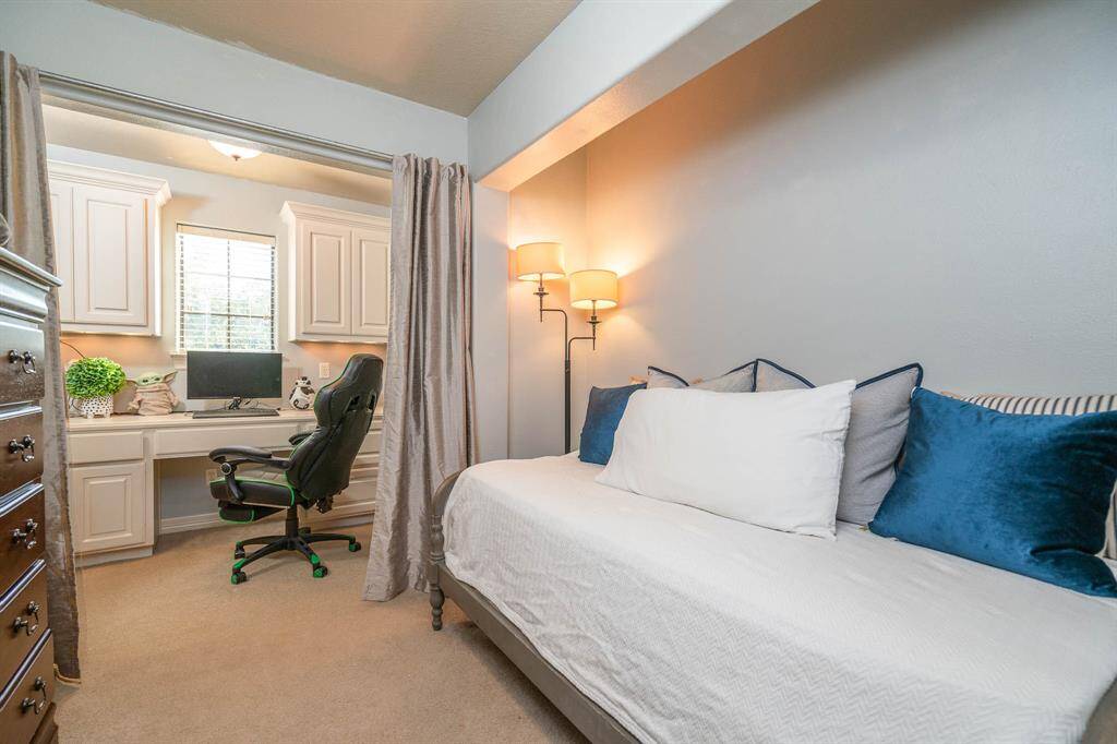 This cozy space can be the optional upstairs bedroom or upstairs office space. Complete with built in desk area and cabinetry. Undercabinet lighting and plenty of working space to do virtual learning from home - yay! Window that overlooks the front of the home with 2 inch blinds.