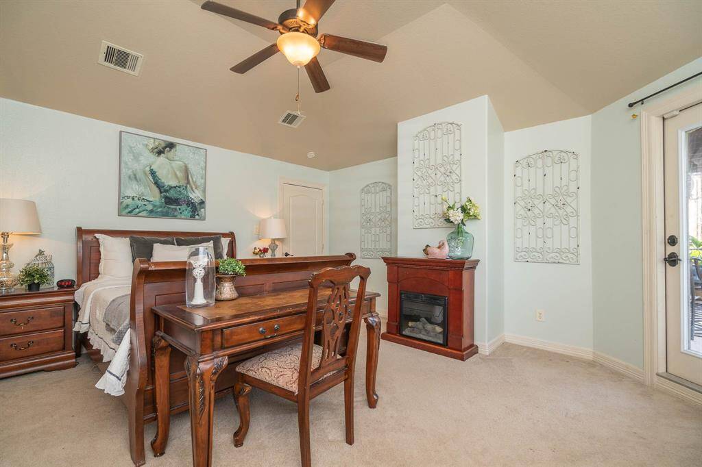This grand room is the 6th upstairs bedroom with access to the balcony pictured on the right. High ceilings with a lighted ceiling fan. Wall of windows with 2 inch blinds.