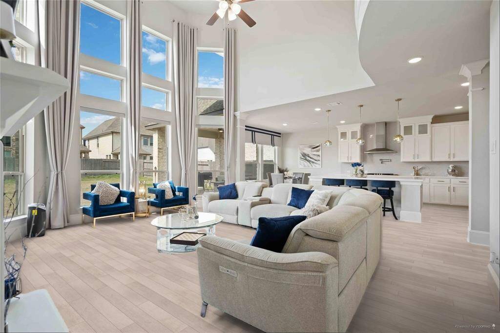 Living room huge open lighting and brand new lvp flooring***photos staged from previous photos***