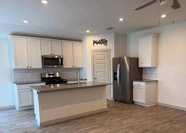 Kitchen with island overlooking the living area