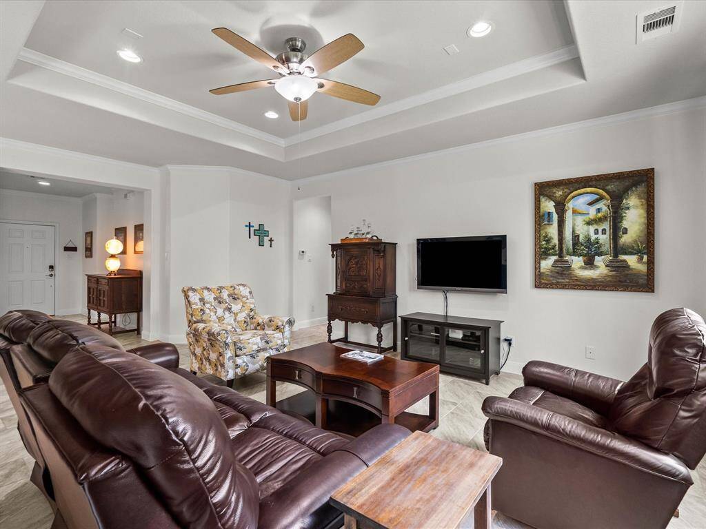 Central living area has ceiling fan plus canister lighting!