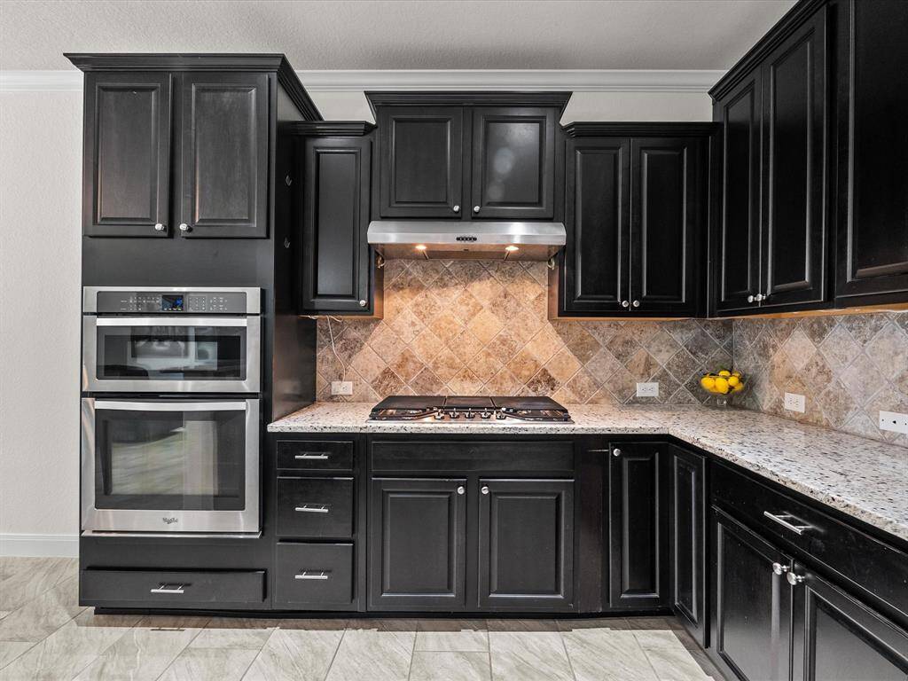 Abundant counter space and cabinets! Built-in stainless steel electric oven and built in stainless steel microwave. Plus a gas cooktop!