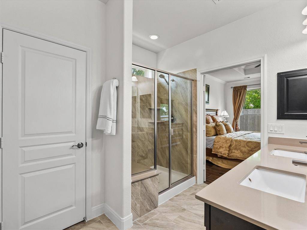 Large linen closet plus over-sized walk-in shower with shower seat.