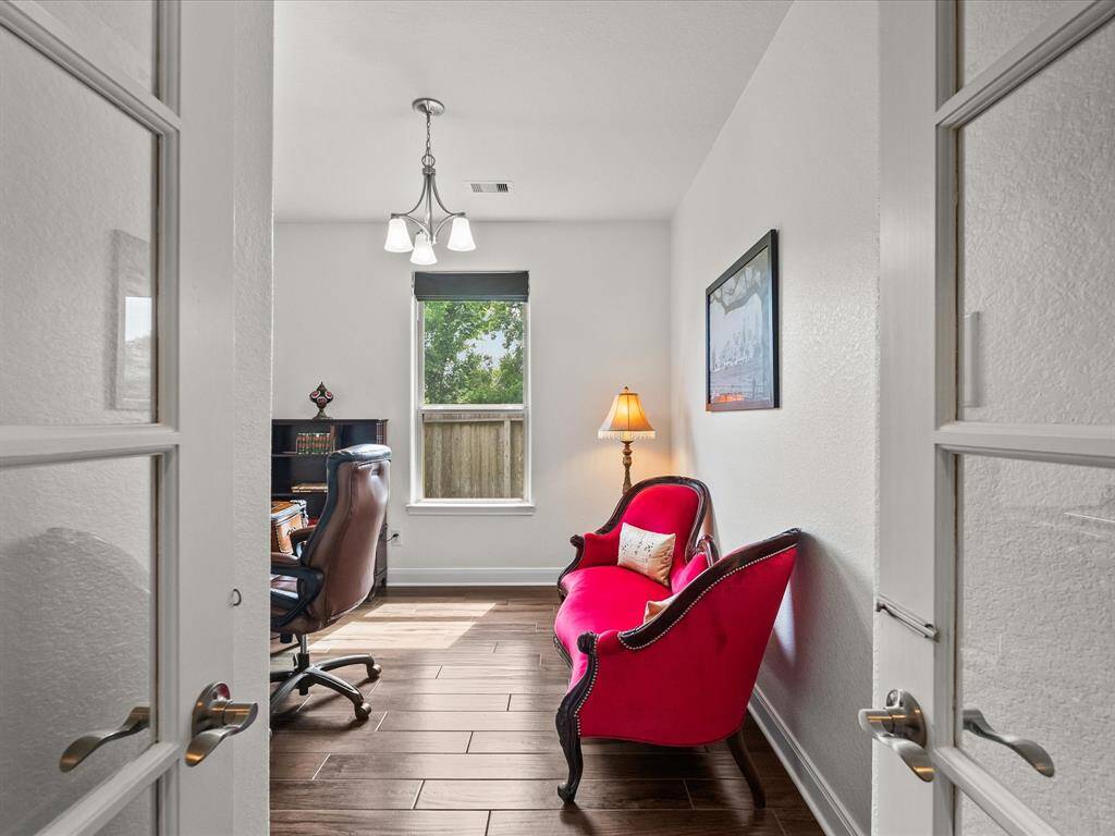 As we continue through the glass french doors we enter the private study. Perfect for office, TV room, craft room, music room, or exercise studio!