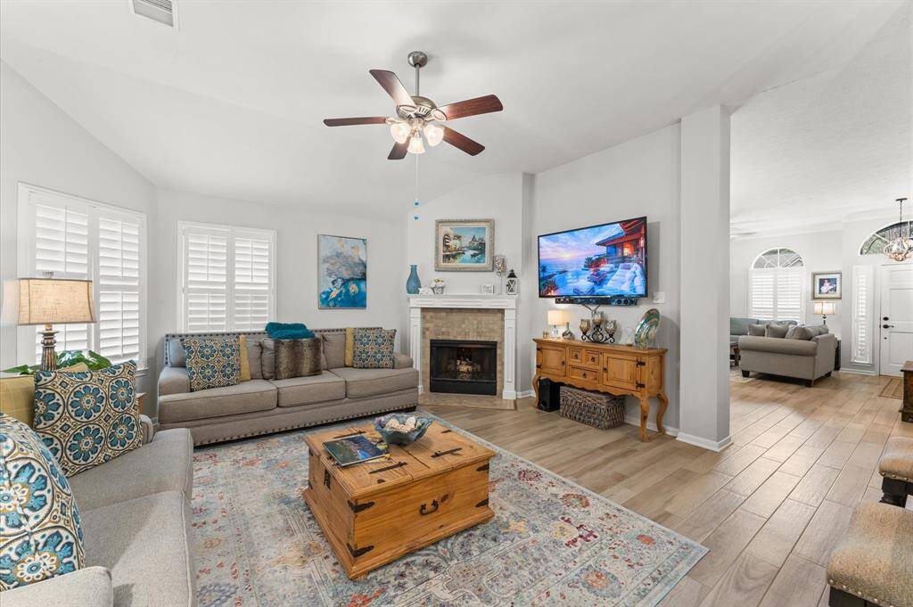 Livingroom right off the kitchen offers a gas log fire place.