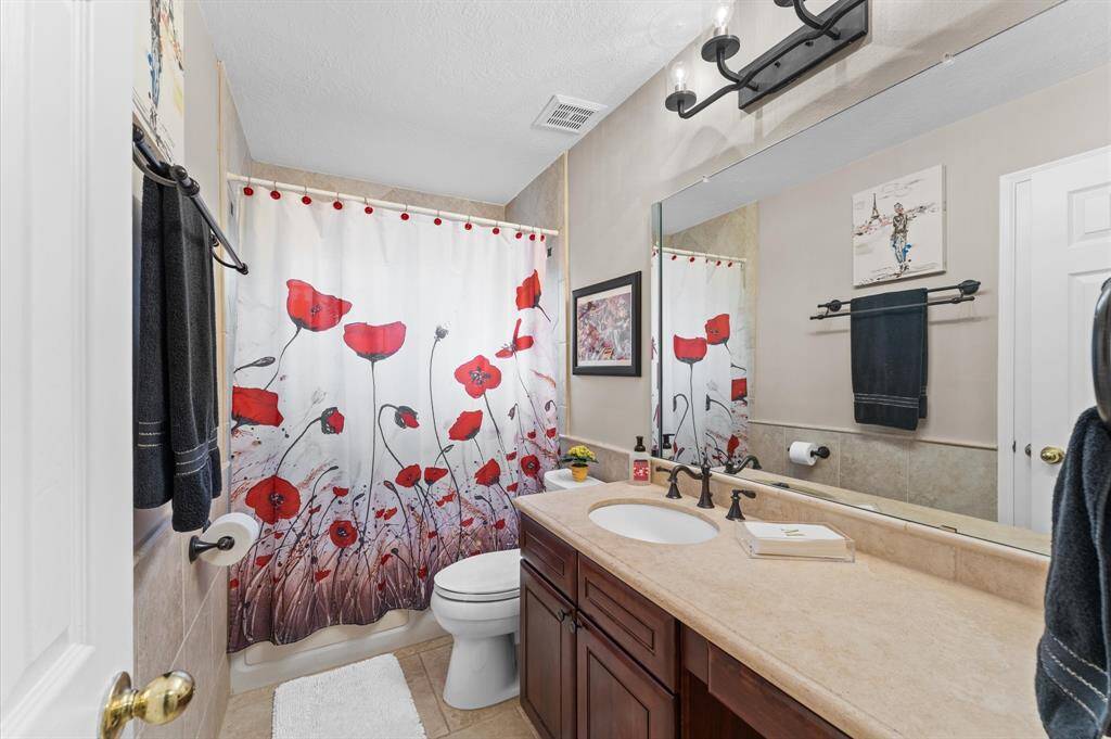 Secondary bathroom offers Jet tub, vanity and a towel closet!