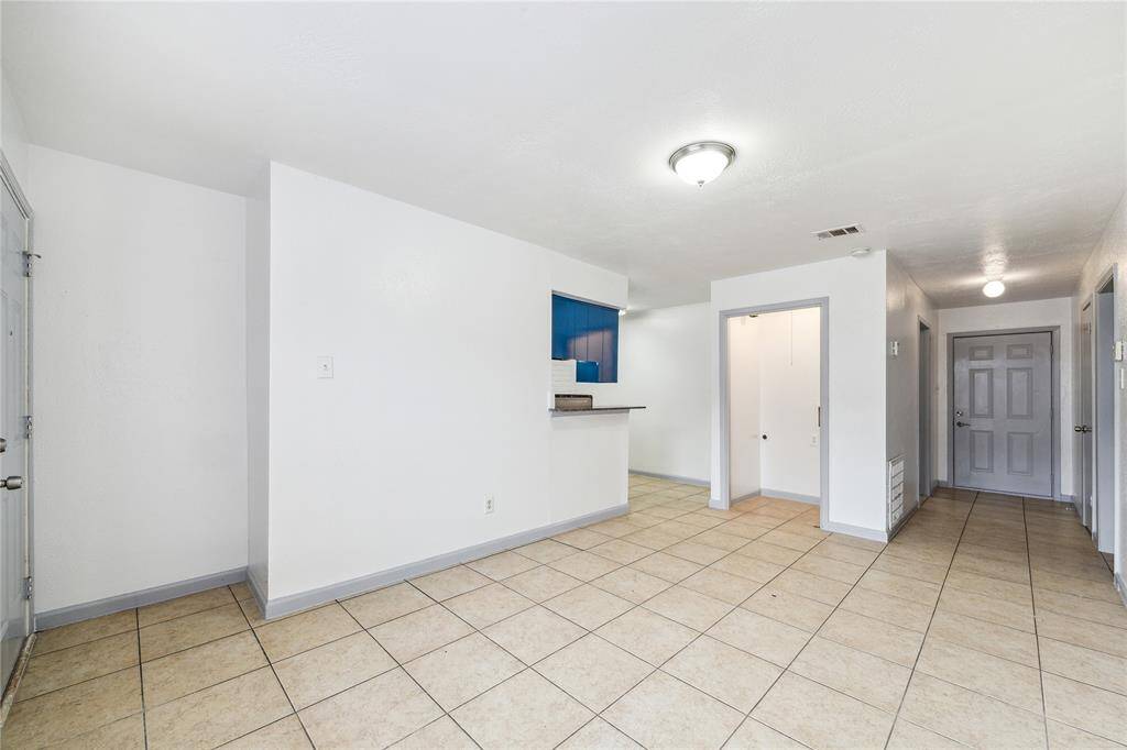 Spacious living room connects to the dining area and kitchen