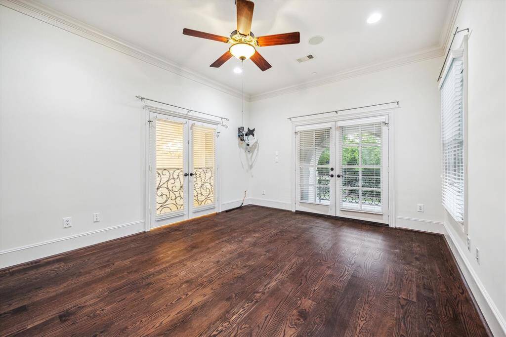 Chic and airy, this upstairs bedroom includes its own en-suite bath and private balcony access — perfect for a morning coffee or evening breeze.