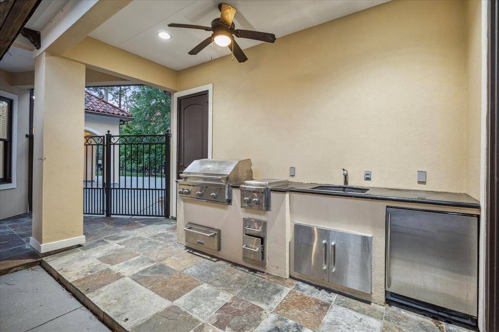 Dine al fresco under the rustic wood-beam pavilion, perfectly positioned to enjoy poolside views and cool evening breezes.