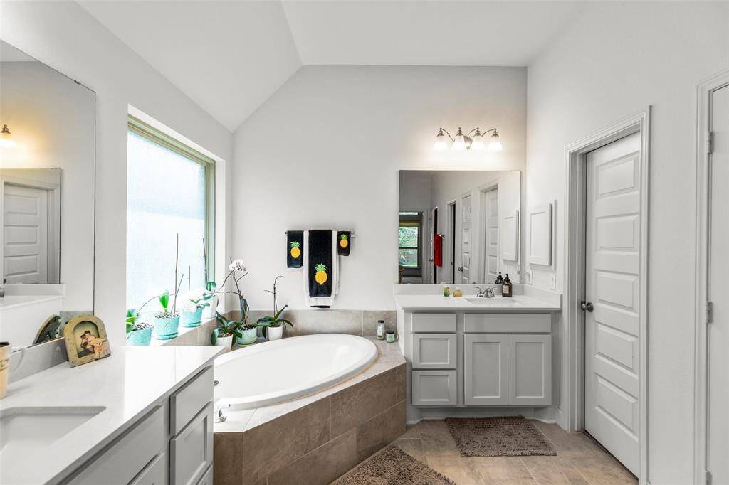 Also, a separate garden tub and dual vanities