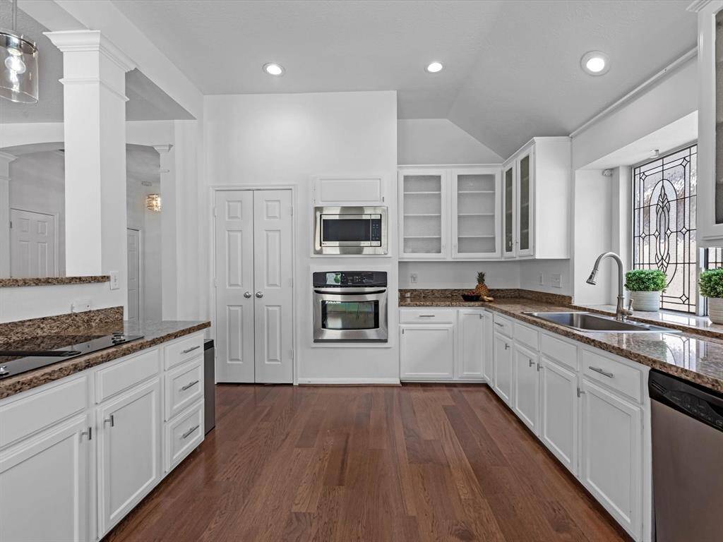 Plenty of storage and stainless steel appliances help complete this spectacular space.