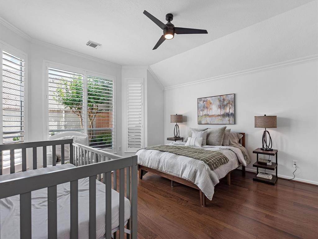 Your Primary Retreat with wood floors and plenty of windows overlooking the back yard.