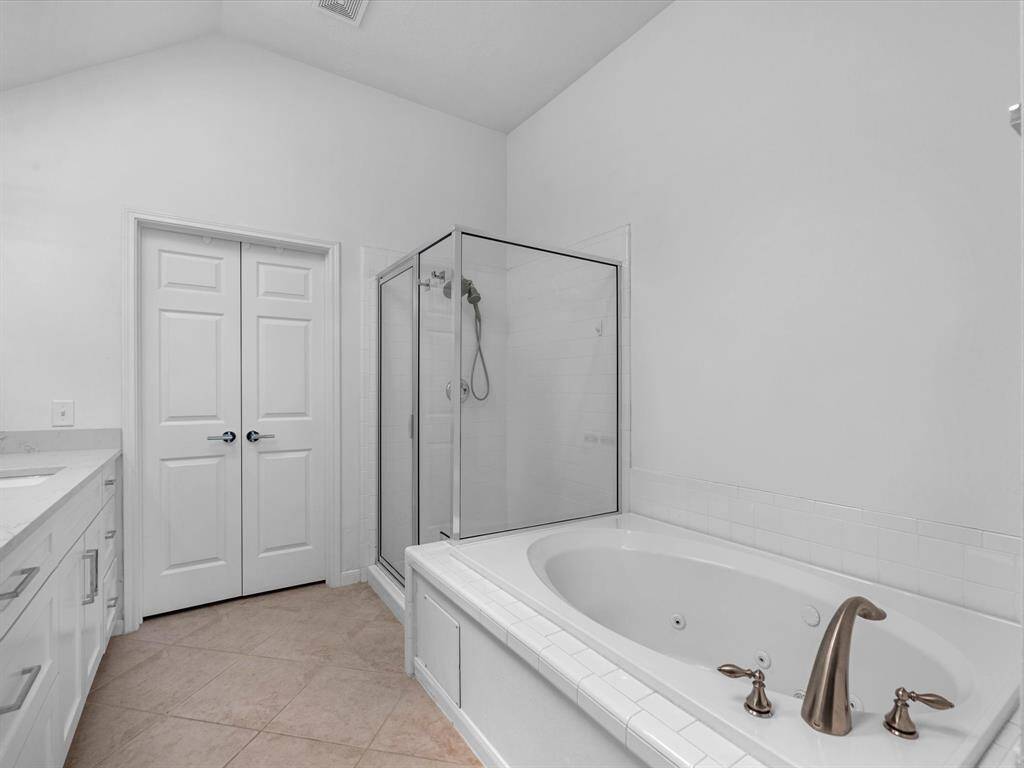 Walk-in Shower & Jetted Garden Tub.