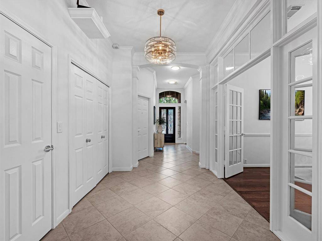 The Main Hall with the enclosed Dining Room or Flex Room to the right and Laundry Room to the left.