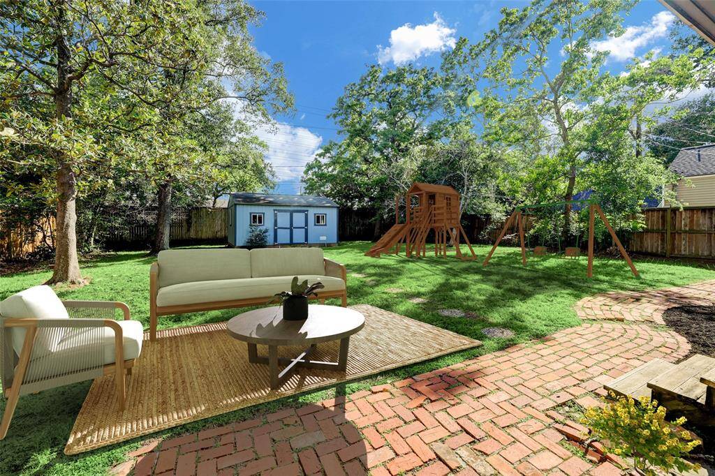 An entertainers dream, the back lawn is one of the largest in the neighborhood.
