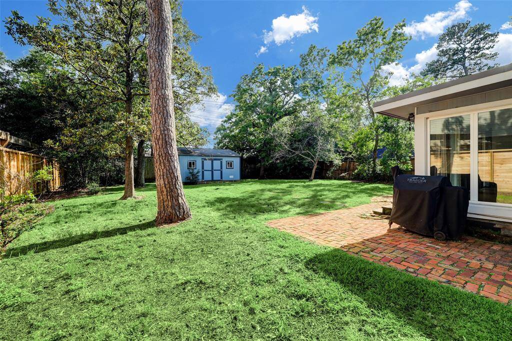 The oversized yard wraps around both sides of the home.