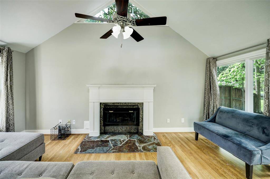 Vaulted ceilings compliment the natural sunlight that spills into this spacious living room.