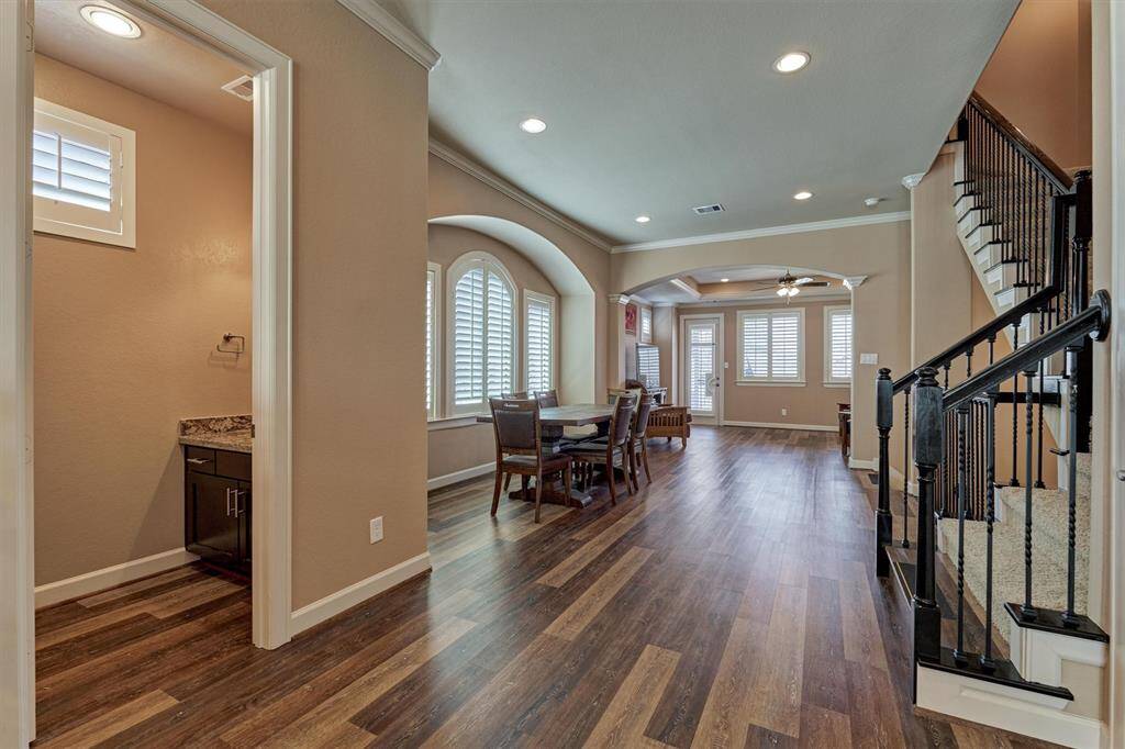 From the kitchen, you can enjoy a view of the second level's open floor plan, perfect for entertaining.