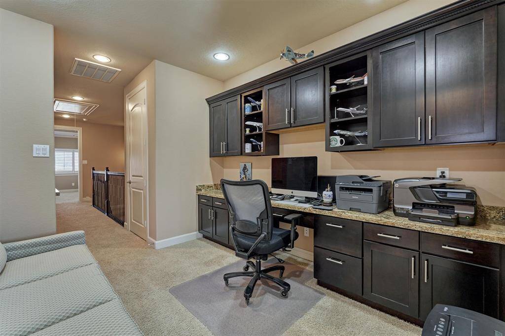 The office area is such a great use if space and is conveniently located down the hall from the primary bedroom.